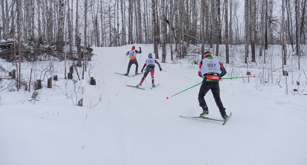 Skiers heading back out on the trail at the Don Allen Saskaloppet near La Ronge Saskatchewan
