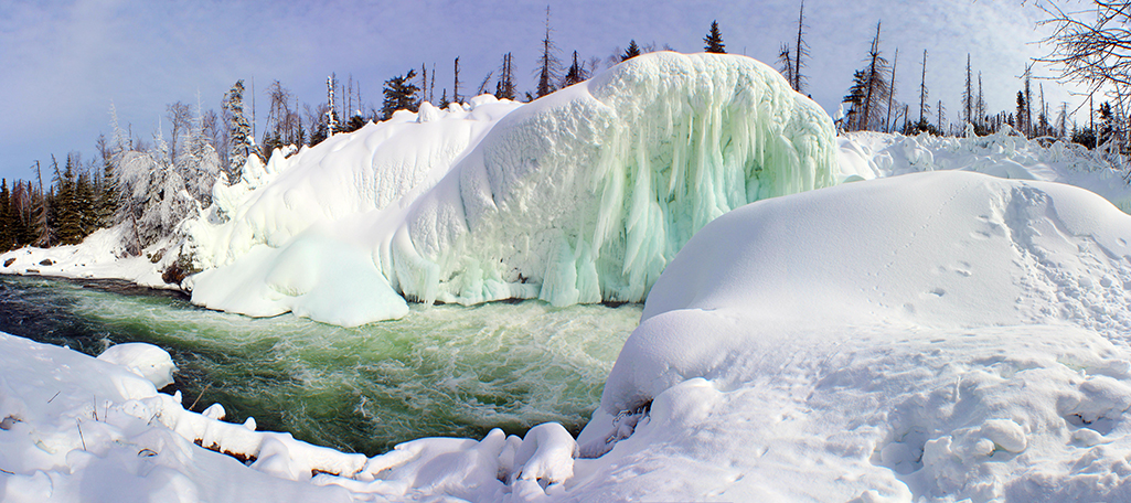 A wintertime, icy view of Nistowiak Falls in northern Saskatchewan