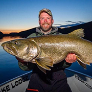 Bret Amundson holding a giant lake trout on Tazin Lake Saskatchewan