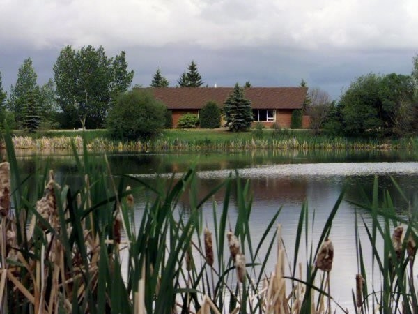 Our local clubhouse next to a well treed dugout.