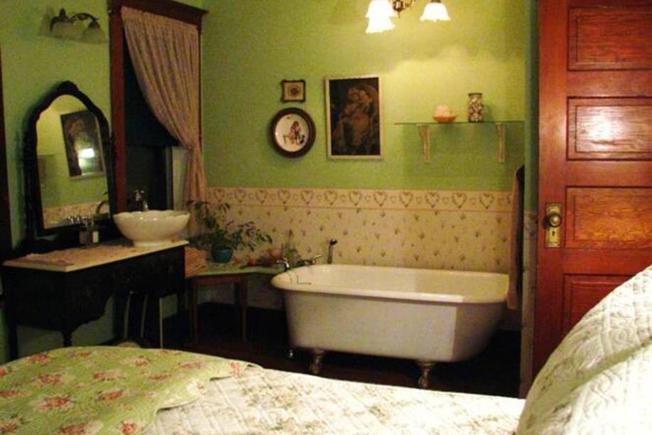 The Merry Widow's Room - Private bath, claw foot tub, queen size bed, balcony, pretty decor in soft greens & creams